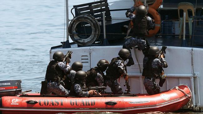 The Philippines and Japanese coastguards hold their annual anti-piracy exercise in the waters off Manila Bay yesterday.