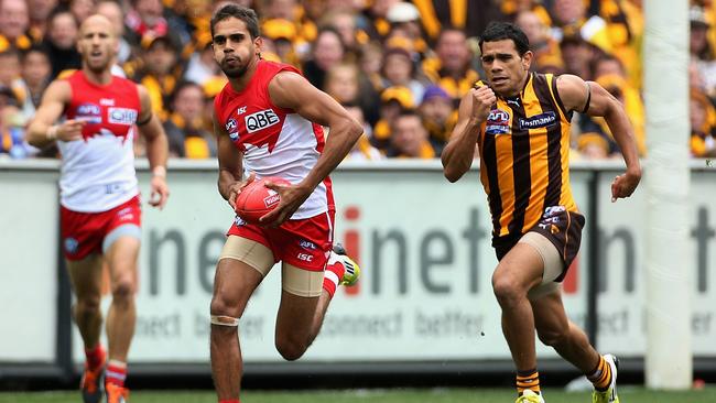 A rare photograph of the only time someone ever outran Cyril Rioli.