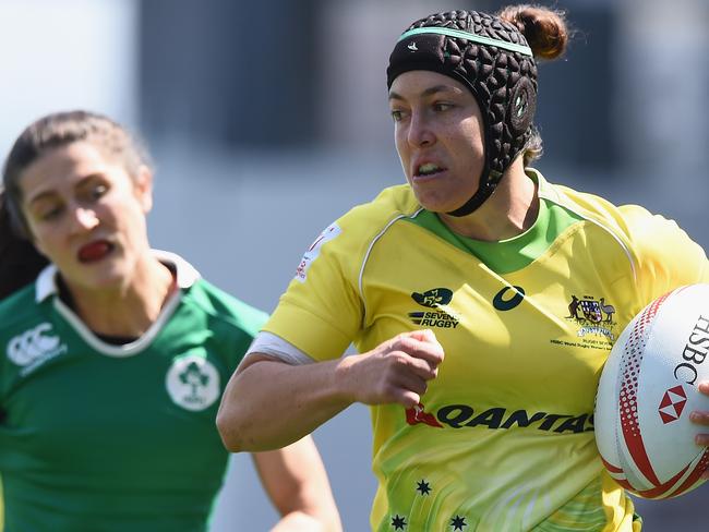 Emilee Cherry makes a break to score a try against Ireland in Japan.