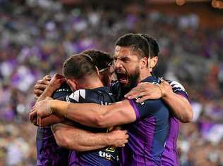 Storm players celebrate after scoring a try during the NRL grand final 2017. Police are bracing themselves for a spike in family violence this grand final weekend. Picture: MICK TSIKAS