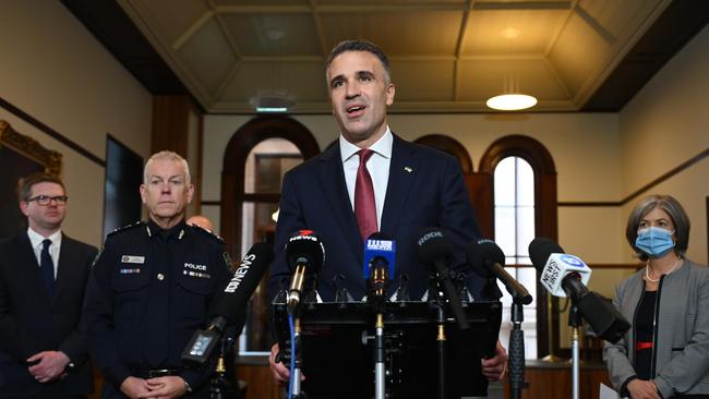 Premier Peter Malinauskas announces its revokation with Mr Stevens and chief public health officer Professor Nicola Spurrier watching with Health Minister Chris Picton. Picture : NCA NewsWire / Naomi Jellicoe