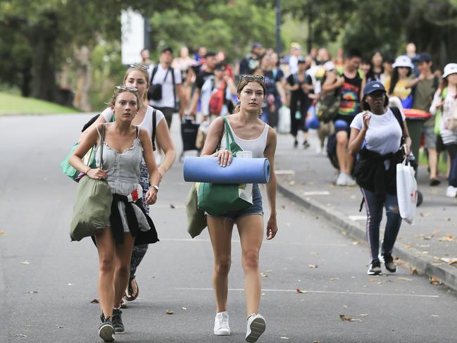 Crowds flock into Mrs Macquarie's Chair to claim positions for tonight's New Years Eve celebrations in Sydney. Picture: Dylan Robinson