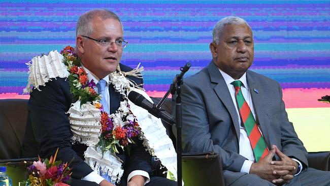 Australian Prime Minister Scott Morrison attends a Traditional Ceremony of Welcome with the Prime Minister of Fiji Frank Bainimarama, in Suva, Fiji, Thursday, January 17, 2019. Scott Morrison is in Fiji to announce significant economic and security partnership with the island nation.(AAP Image/Dan Himbrechts) NO ARCHIVING