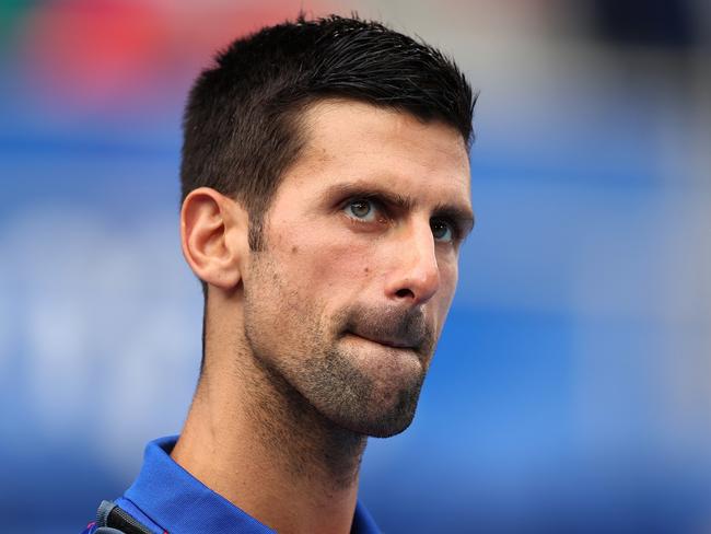 TOKYO, JAPAN - JULY 30: Novak Djokovic of Team Serbia walks on to court for his Men's Singles Semifinal match against Alexander Zverev of Team Germany on day seven of the Tokyo 2020 Olympic Games at Ariake Tennis Park on July 30, 2021 in Tokyo, Japan. (Photo by Clive Brunskill/Getty Images)