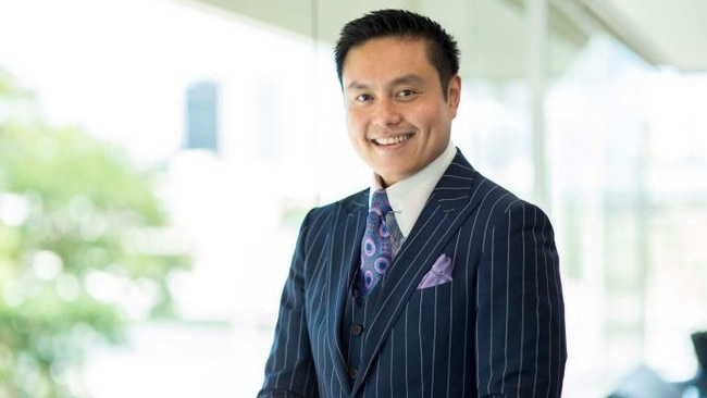 Brisbane lawyer Daniel Hua has amassed more than 80 Hugo Boss suits.