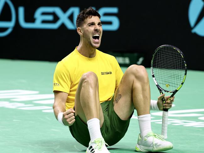 MALAGA, SPAIN - NOVEMBER 21: Thanasi Kokkinakis of Team Australia celebrates after winning his singles match against Ben Shelton of Team USA  in the quarterfinal tie between USA and Australia during the Davis Cup Finals at Palacio de Deportes Jose Maria Martin Carpena on November 21, 2024 in Malaga, Spain. (Photo by Matt McNulty/Getty Images for ITF)