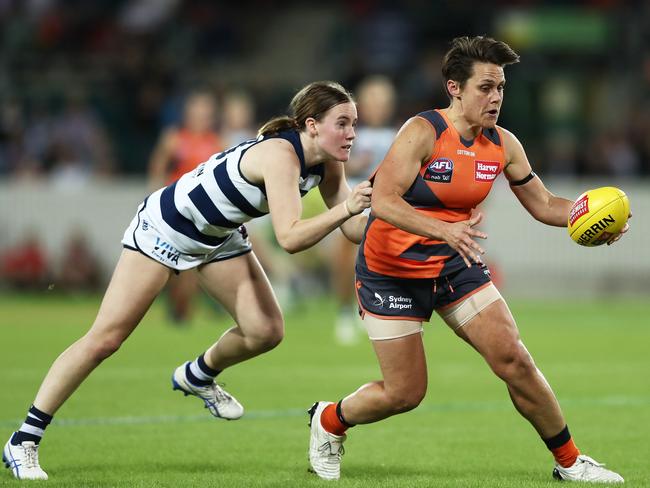 Former GWS player Courtney Gum is challenged by Geelong’s Denby Taylor during a match this season. Picture: Matt Kind/Getty Images