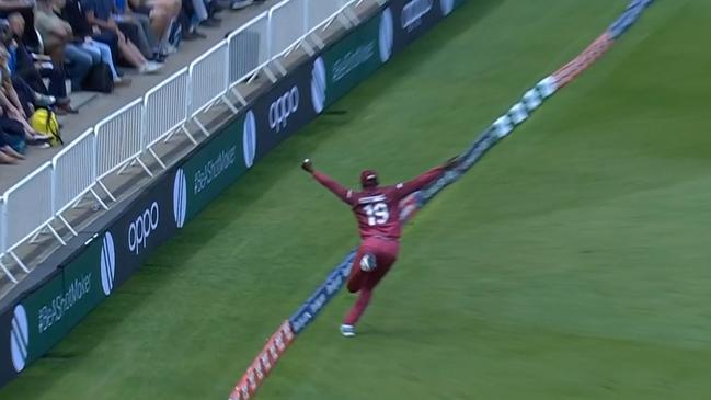 West Indies' Sheldon Cottrell takes a spectacular catch to dismiss Steve Smith.