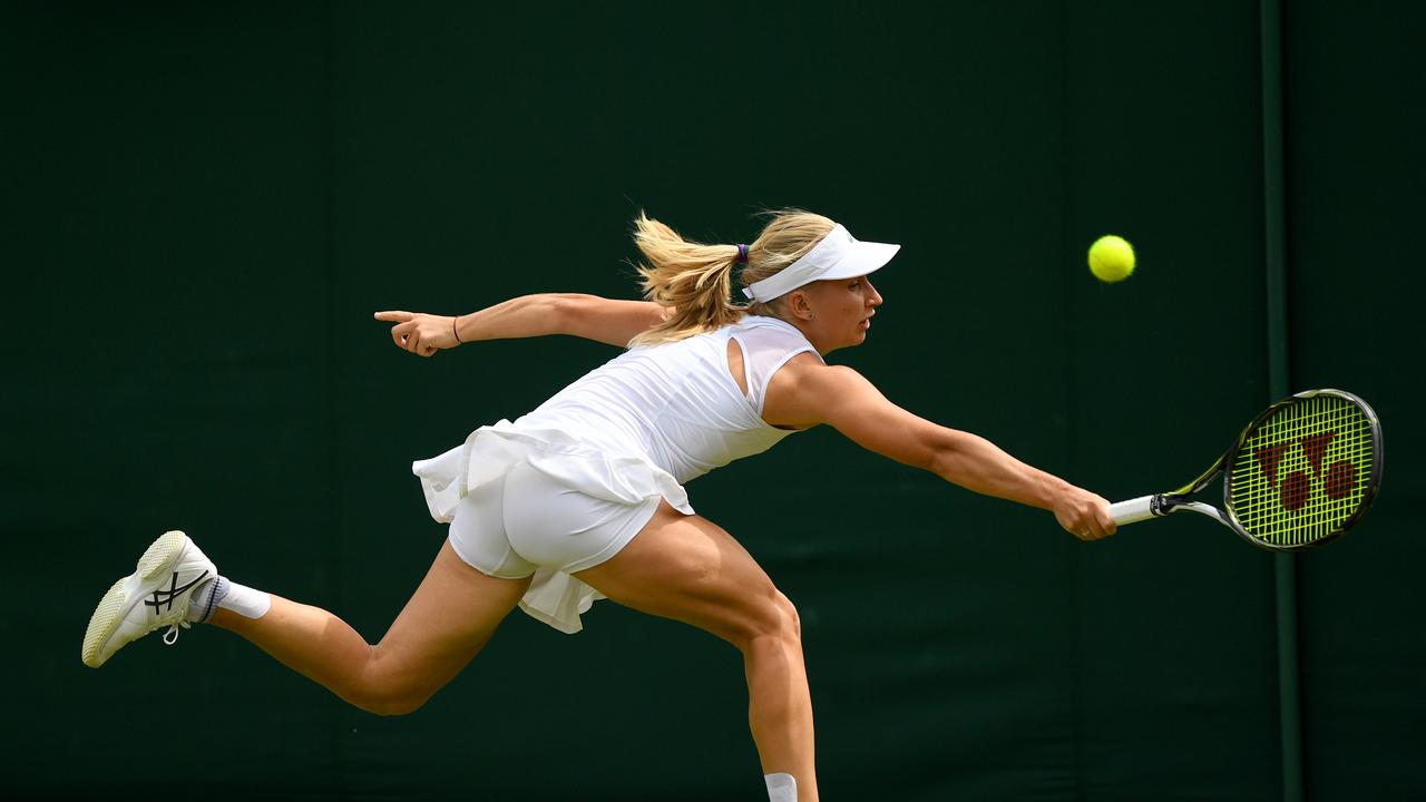 Daria Gavrilova of Australia stretches as she plays a backhand during the Ladies Singles first round match against Petra Martic of Croatia. (Photo by David Ramos/Getty Images)