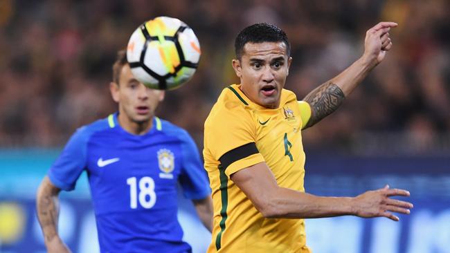 Tim Cahill heads the ball against Brazil at the MCG. Picture: Getty Images.