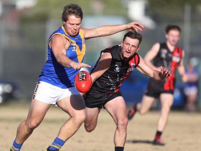 Cranbourne's Max Gearon takes a kick against Hampton Park in 2017. Picture: Stuart Milligan