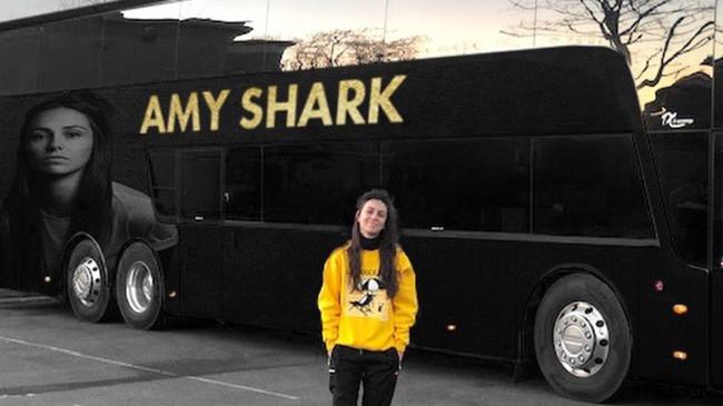 Amy Shark with her tour bus as she plays across Europe and the UK - stowaways were discovered in the luggage compartment trying to sneak into the UK.  PICTURE: Amy Shark Twitter @AmySharkMusic