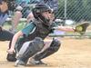 Evie King fielding as catcher for the Warriors. Photo: Julie Cooper Photography.