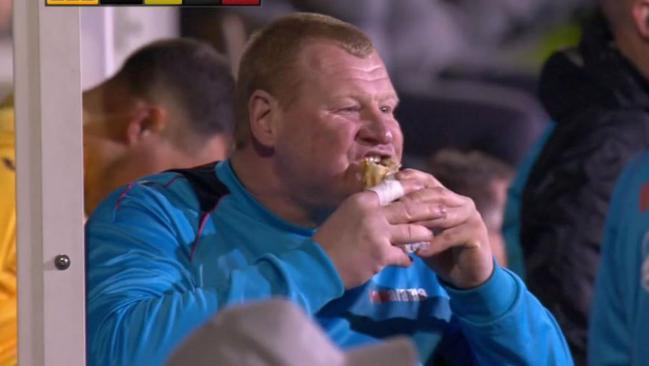 Wayne Shaw eating a pie.