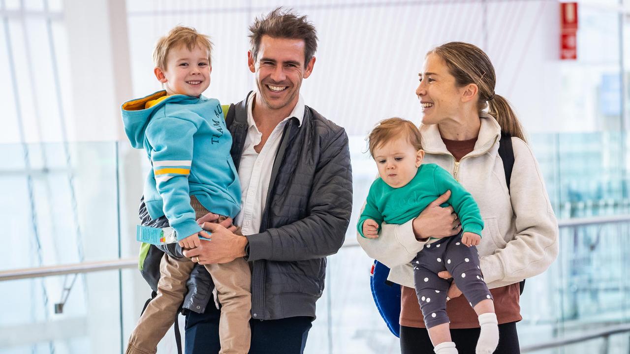 Jessica and Dylan Stenson with kids Billy, 4, Ellie, 9, months, at Adelaide Airport heading to Paris via Gold coast for a half marathon. Picture: Tom Huntley