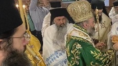 Father John Christodoulos (in the blue lace robes) on Monday Picture: Supplied