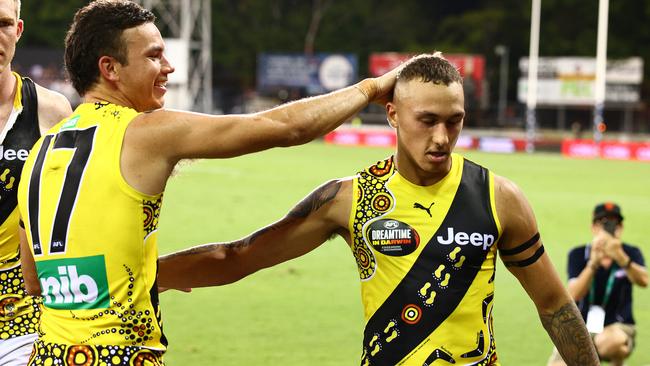 Daniel Rioli celebrates with Shai Bolton after the Tigers defeated the Bombers during the Dreamtime match.