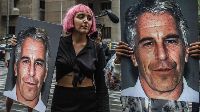 NEW YORK, NY - JULY 08: A protest group called "Hot Mess" hold up signs of Jeffrey Epstein in front of the Metropolitan Correction Center on July 8, 2019 in New York City. According to reports, Epstein will be charged with one count of sex trafficking of minors and one count of conspiracy to engage in sex trafficking of minors.   Stephanie Keith/Getty Images/AFP == FOR NEWSPAPERS, INTERNET, TELCOS & TELEVISION USE ONLY ==