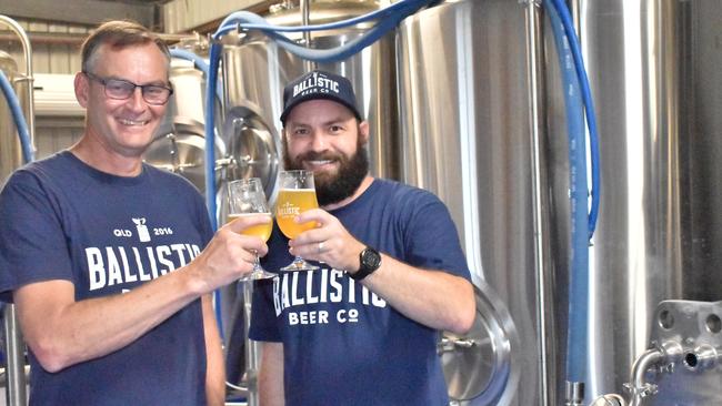 Ballistic Brewing Co's founder David Kitchen and resident Whitsundays brewer Liam Paget celebrate the opening of a new 1000-litre brewery and taphouse at Cannonvale. Picture: Kirra Grimes.