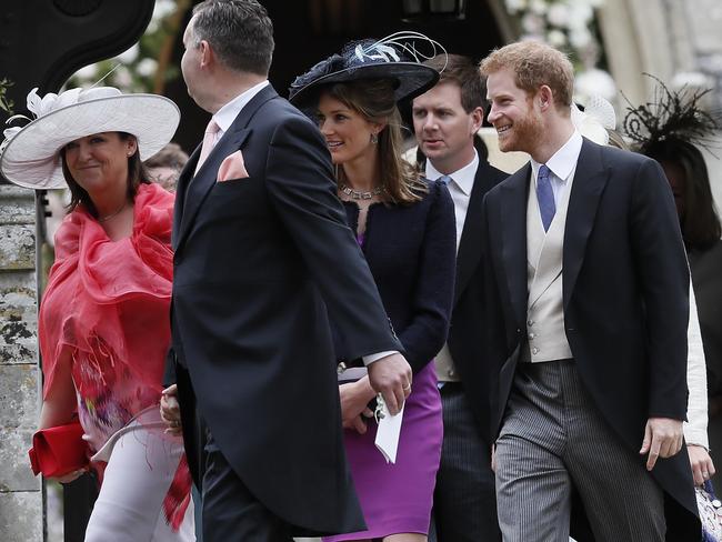 Prince Harry leaves the ceremony alongside fellow guests, with no sign of Meghan.