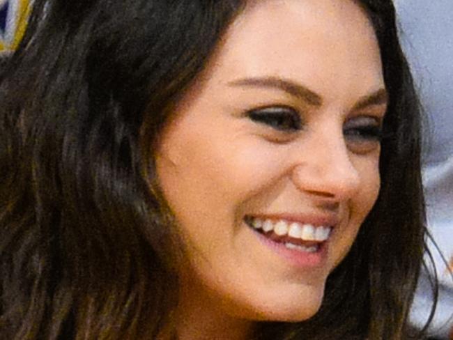 LOS ANGELES, CA - DECEMBER 19: Mila Kunis (L) and Ashton Kutcher attend a basketball game between the Oklahoma City Thunder and the Los Angeles Lakers at Staples Center on December 19, 2014 in Los Angeles, California. (Photo by Noel Vasquez/GC Images)