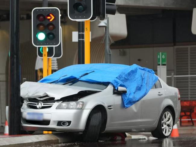 A man has died after being hit be a vehicle that was allegedly seen driving erratically moments before the incident.A blue tarpaulin covers the car involved in the incident in Bayswater. Picture: ABC