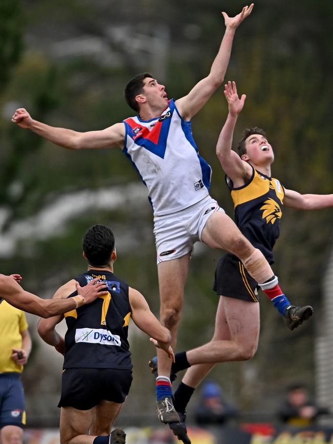 Matthew Harman flies against Samuel Indian in the ruck. Picture: Andy Brownbill