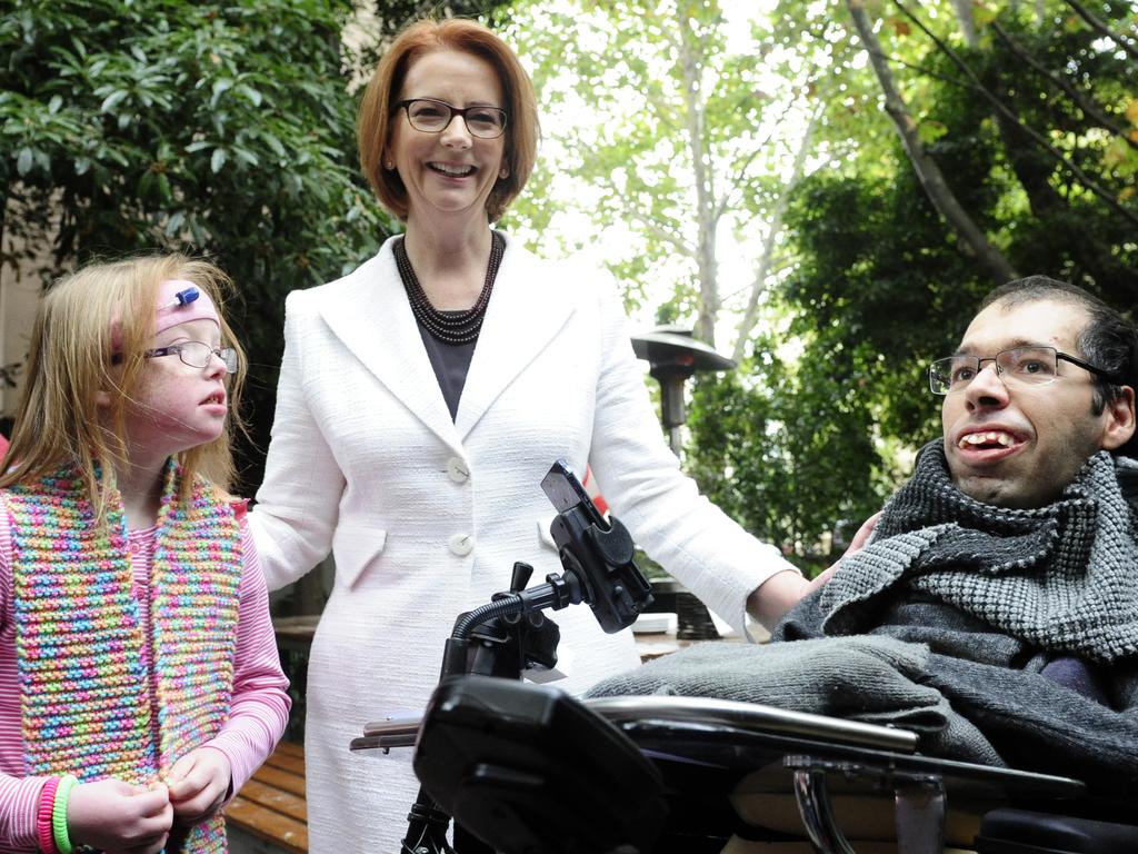 Dr George Taleporos (right) with then-Prime Minister Julia Gillard. Picture: Julian Smith/AAP