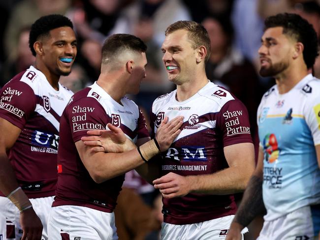 SYDNEY, AUSTRALIA - JULY 21: Tom Trbojevic of the Sea Eagles celebrates with team mate Reuben Garrick after scoring a try during the round 20 NRL match between Manly Sea Eagles and Gold Coast Titans at 4 Pines Park, on July 21, 2024, in Sydney, Australia. (Photo by Brendon Thorne/Getty Images)