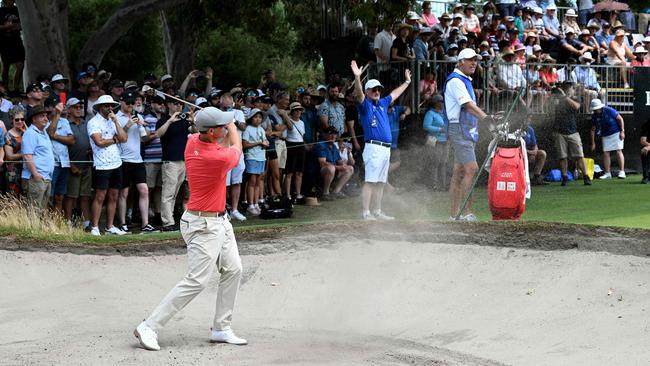 Adam Scott hits out of a bunker during the final round at the Victoria Golf Club Picture: AFP