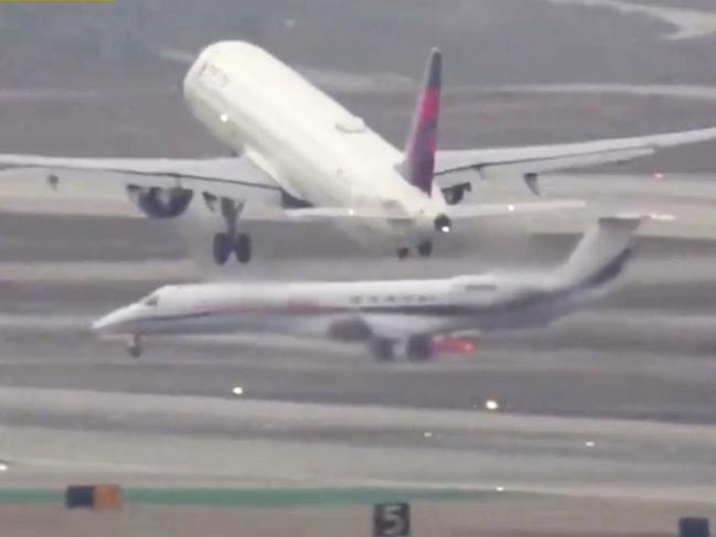 Harrowing footage shows near miss on LAX runway