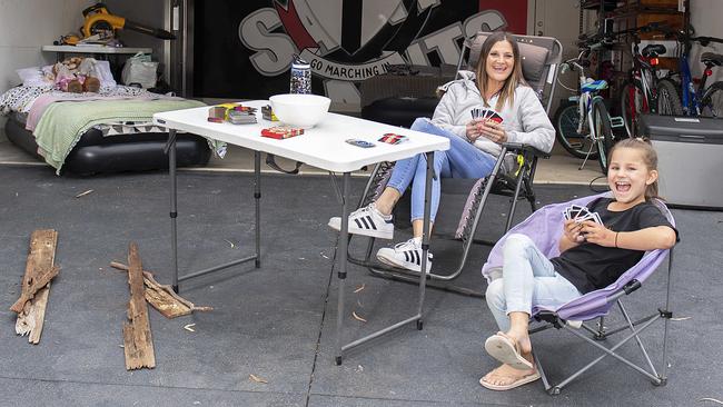 Romy Glenn and her daughter Laila, 7, have set up a makeshift camping site in their garage these school holidays. Picture: Ellen Smith