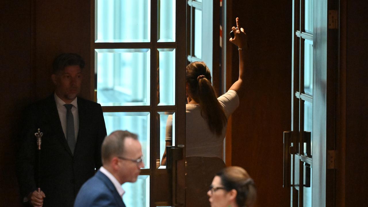 Thorpe walks out after throwing papers at One Nation leader Pauline Hanson in the Senate chamber at Parliament House. Picture: AAP Image/Mick Tsikas