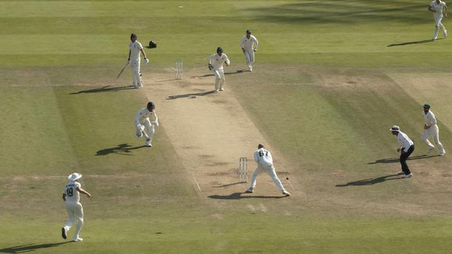 Australia’s Nathan Lyon, No 67, drops the ball and a run-out of England’s Jack Leach goes begging at Headingley. Picture: AP