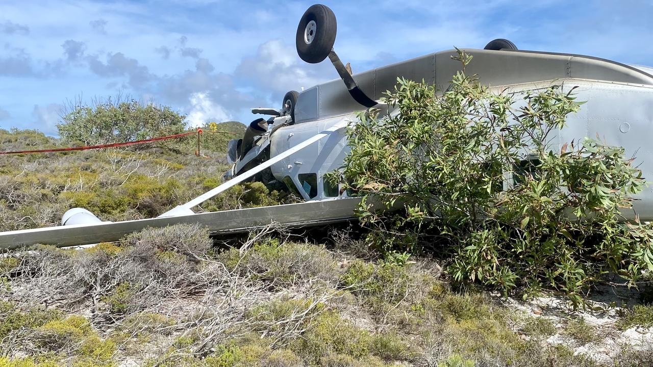 A teenager was among those in a light plane when it flipped.