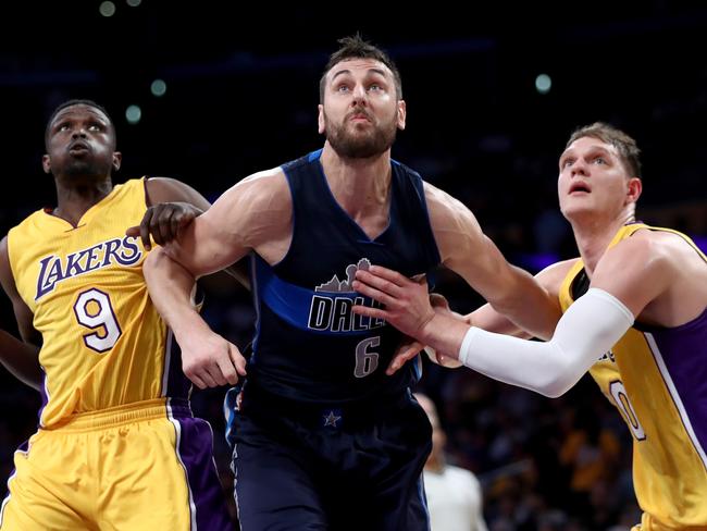 Andrew Bogut (C) has called time on a decorated NBA career.