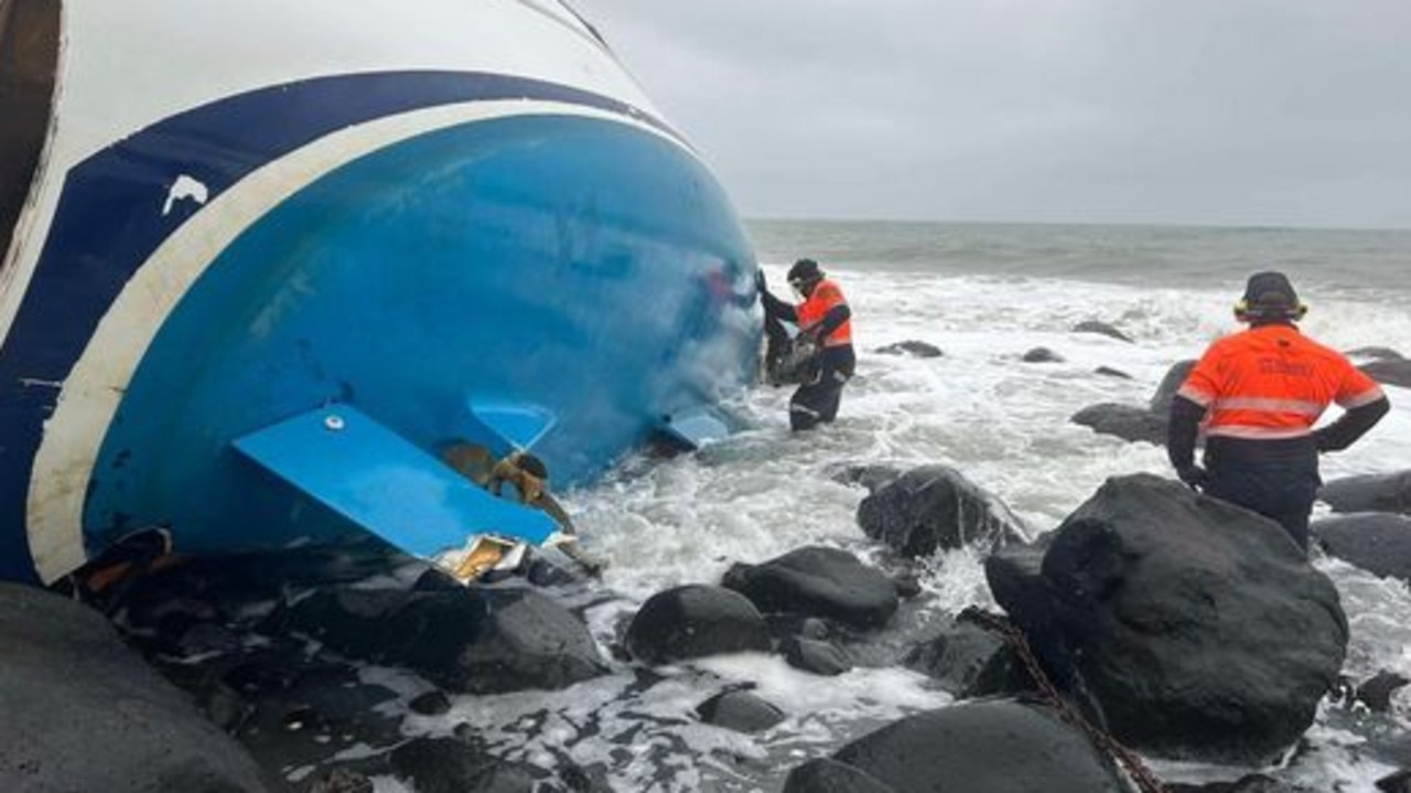 Claytons’ marine team in action as they recover the 12+m yacht from the rocks at Bargara. Picture: Facebook