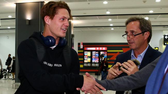 Boom youngster Kalyn Ponga stops to talk to media at Melbourne airport. Picture: Adam Head