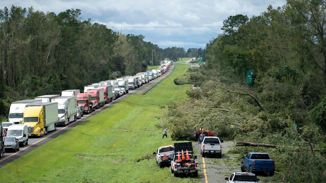 People work to clear I-10 of fallen trees after Hurricane Idalia passed near Madison, Florida. Picture: Sean Rayford/Getty Image