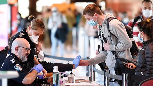 Police screening incoming passengers at Brisbane domestic airport this week. Picture: NCA NewsWire/Dan Peled