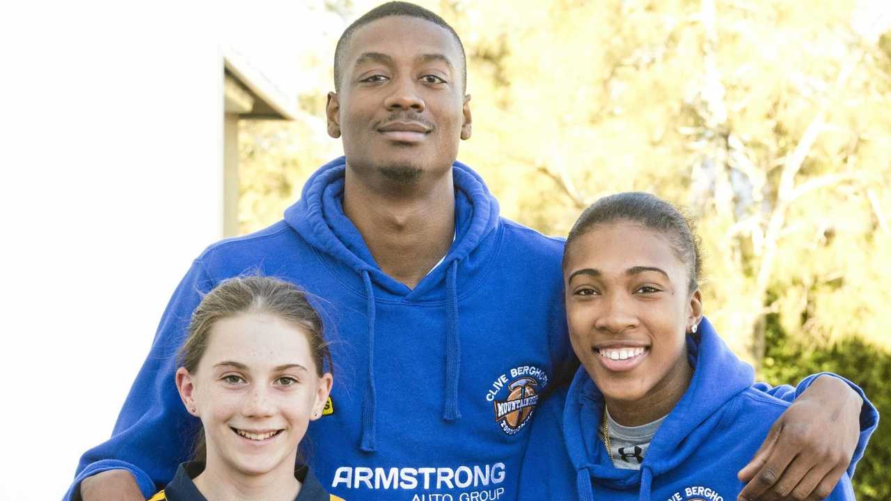 GOOD HABITS: Mountaineers players Harold Ridgeway and Donnaizha Fountain talk with Middle Ridge State School students Laura Fry and Harry Junior Patterson about the club's Positive Choices program. Picture: Nev Madsen