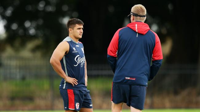 Trent Robinson passing on his guidance to Jayden Nikorima.