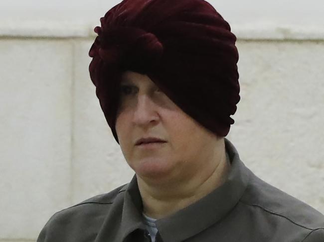 (FILES) In this file photo taken on February 27, 2018 Malka Leifer, a former Australian teacher accused of dozens of cases of sexual abuse of girls at a school, arrives for a hearing at the District Court in Jerusalem. - Israel's highest court December 15, 2020 rejected an appeal against extradition to Australia of Malka Leifer, a former Jewish ultra-Orthodox school principal accused of sexual abuse of many of her pupils there."With the issuance of our judgement, all the arguments are closed and the declaration of extradition takes final effect," said the Supreme Court ruling, published by the justice ministry. (Photo by AHMAD GHARABLI / AFP)