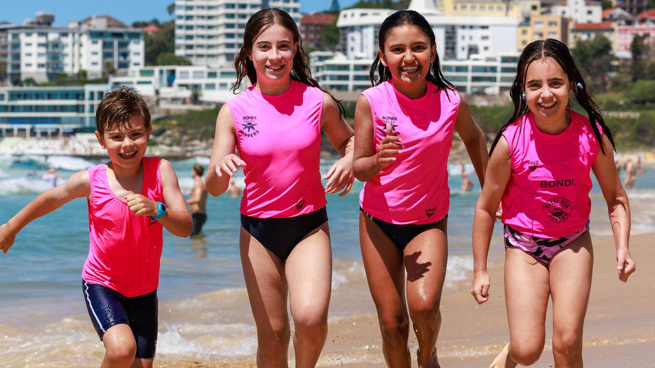 Owen Harvey, nine, (left) with other Bondi Nippers Milla Shemesh, 12, Poppy Singh, nine, and Abbie Shemesh, nine, at Bondi Beach. Picture: Justin Lloyd