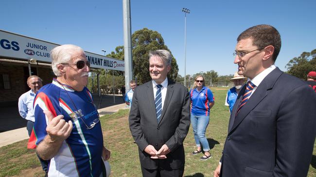 Pictures of Finance Minister Mathias Cormann and Berowra MP Julian Lesser visiting the Greenway Park and meet with reps of sports club who want an upgrade to the park. (AAP Image / Julian Andrews).