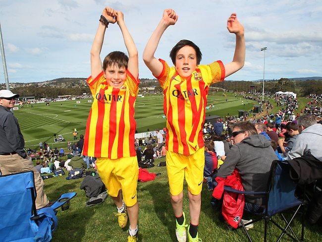 Keon Paulides and Ethan Galbraith, both of Sandy Bay, show their delight at being at the A League game. Picture: Kim Eiszele