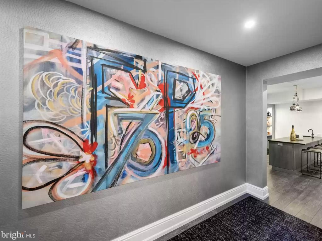 Art hangs in the hallway near one of the bar/kitchen areas. Picture: Realtor