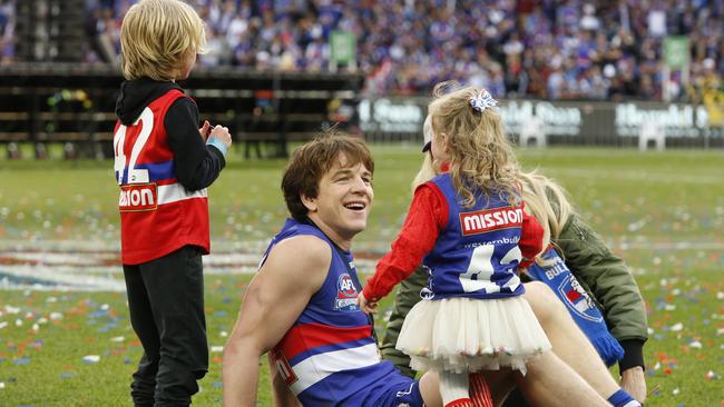 Liam Picken soaks up the Grand Final win with his family. Picture: David Caird