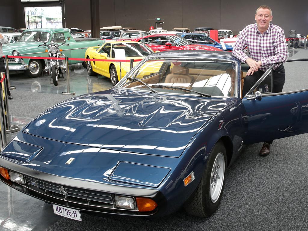 Gosford Classic Car Museum owner Tony Denny with some of the new cars at the museum. For summer guide. Picture: Mark Scott