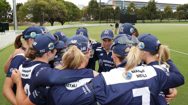 Sophie Molineux, captain of Victoria talks to her team before taking the field during a WNCL match with South Australia.